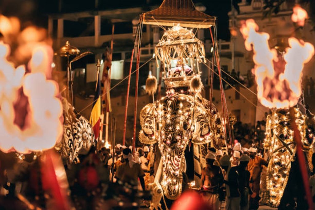 Sri Lanka Kataragama Festival parade with golden elephant and torches